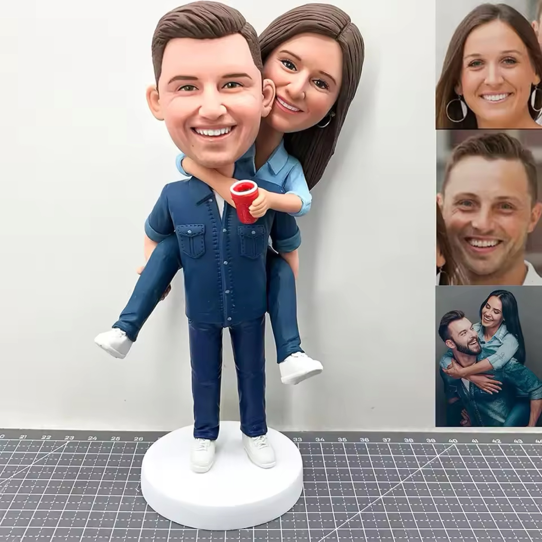 Custom couple figurine shown with the reference photos